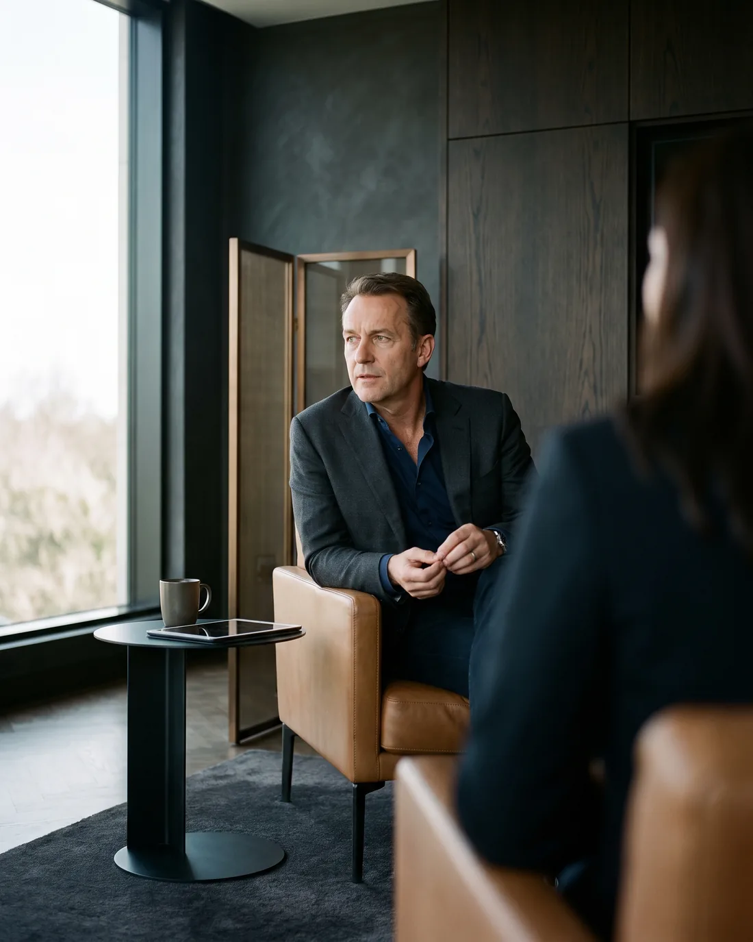 A senior CHRO reviewing the work in a calm Washington DC boardroom